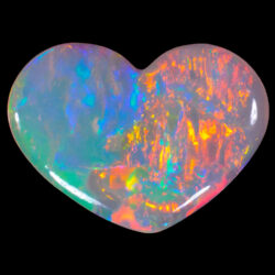 0.49ct crystal opal heart showing strong orange and green fire from Coober Pedy
